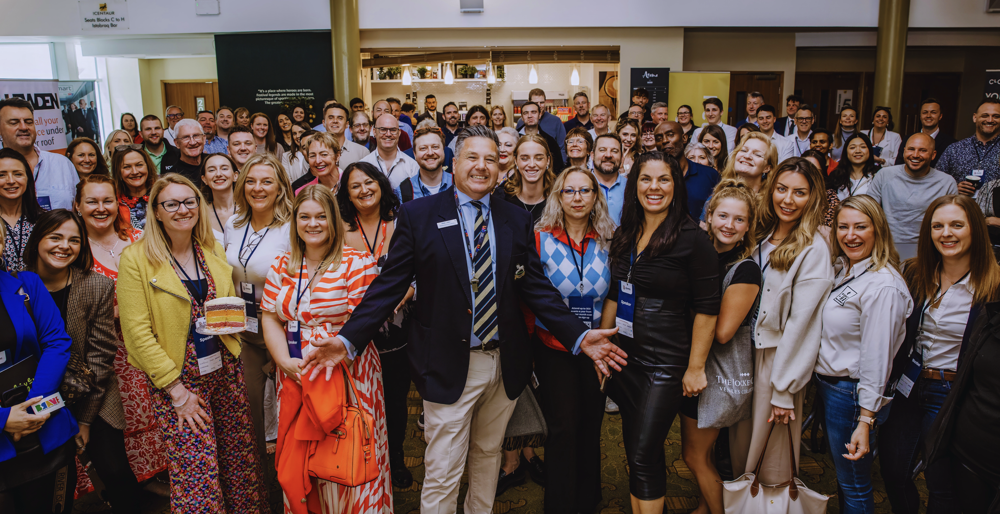Attendees of the BGN show event posing together, showcasing a vibrant atmosphere and diverse participants.