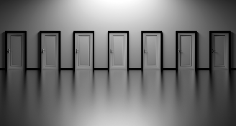 A row of closed doors against a minimalist grey background.